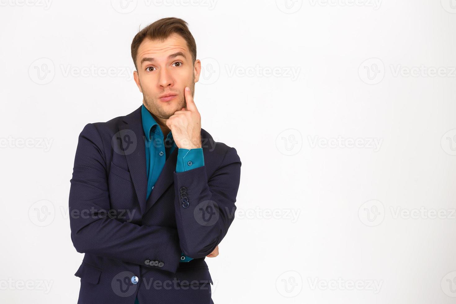 A view of a shocked young businessman isolated on white background photo