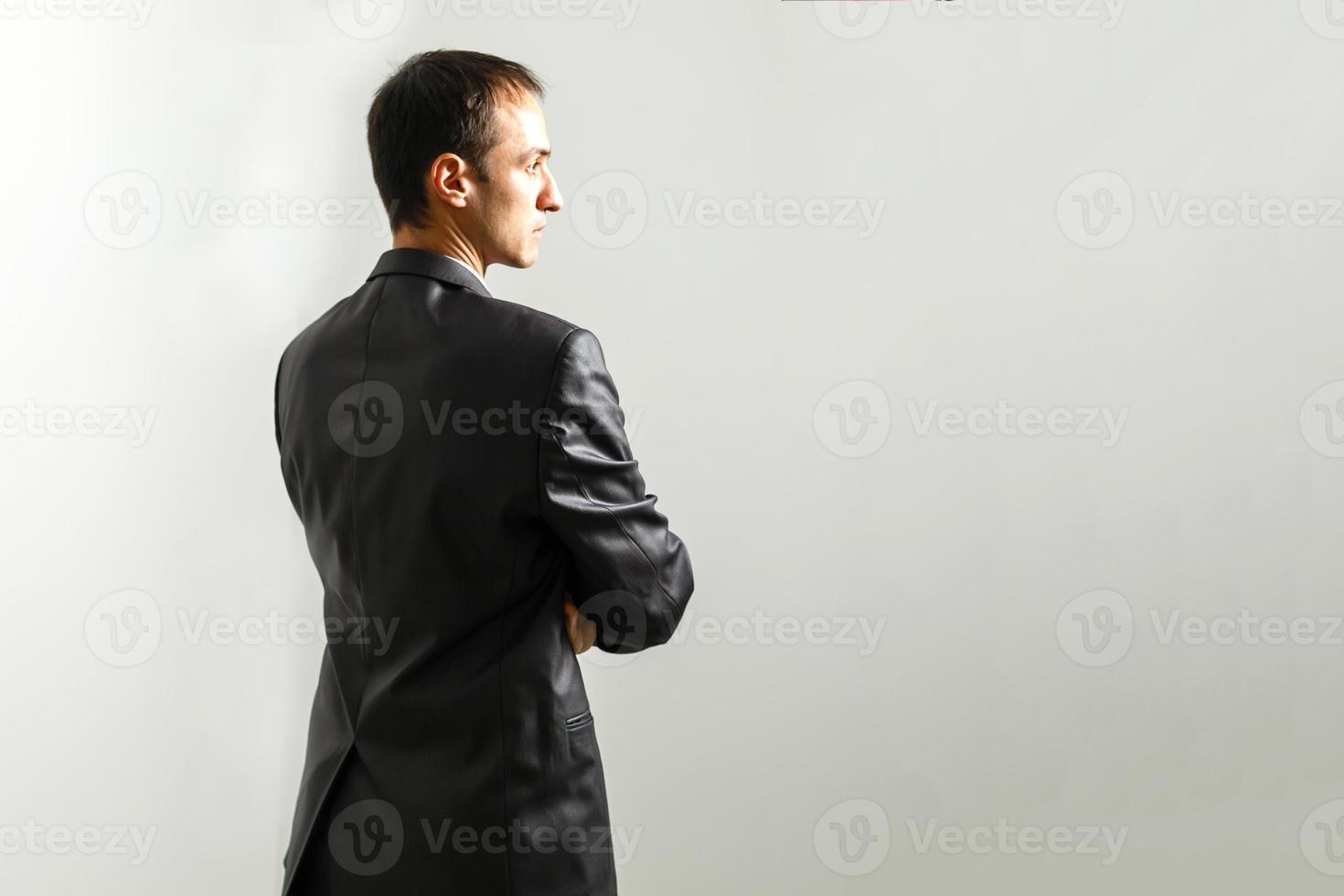 Working with joy. Businessman standing against white background photo