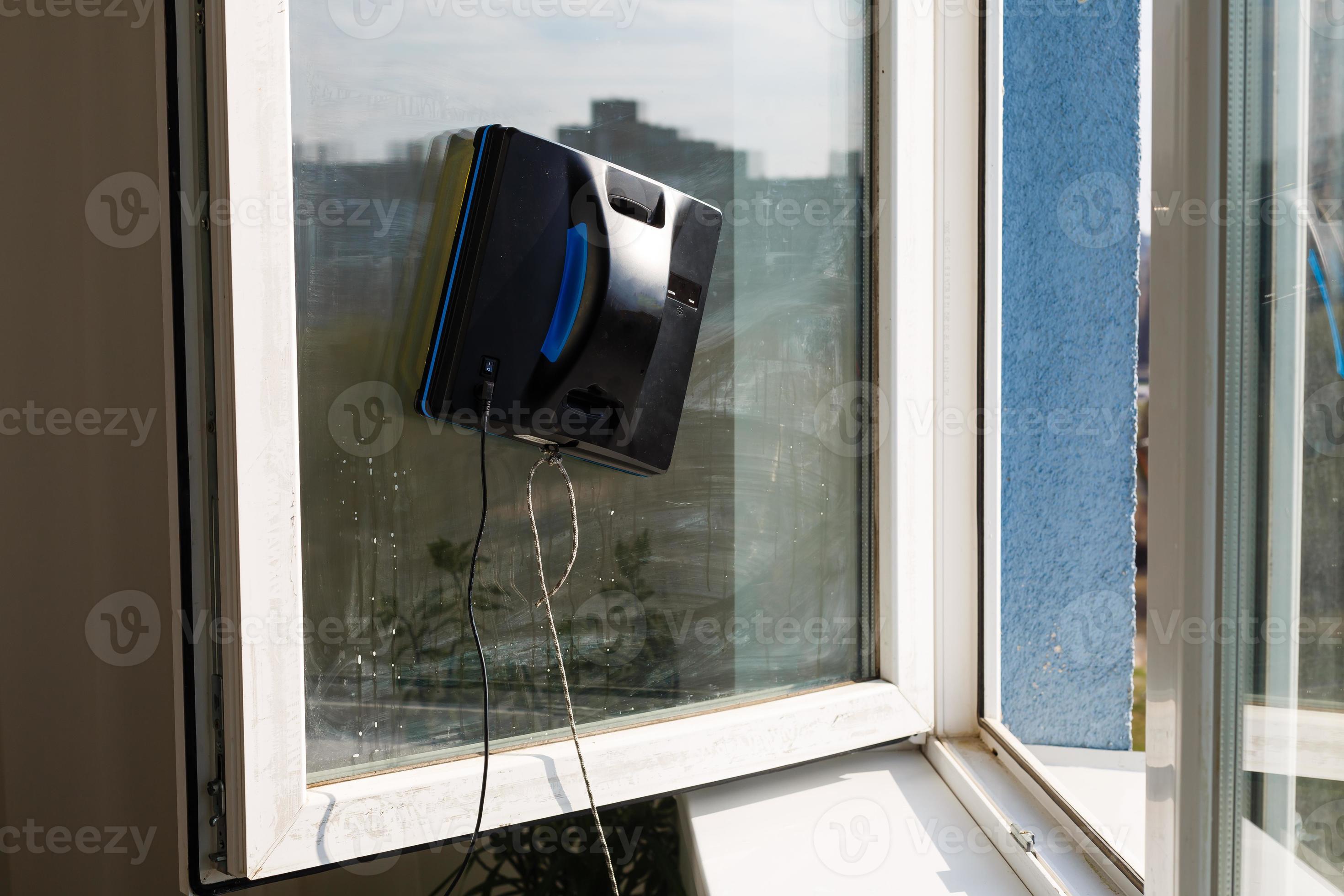 Detail of a glass cleaning robots acting behind a window 16264956 Stock