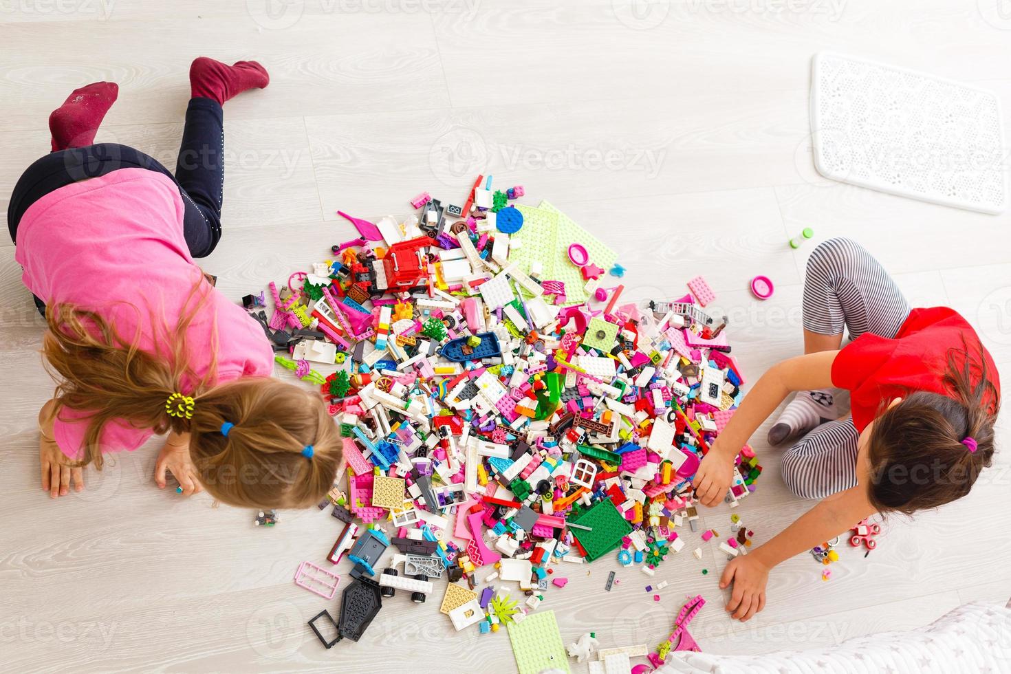 Two cute little girls playing role game in daycare photo