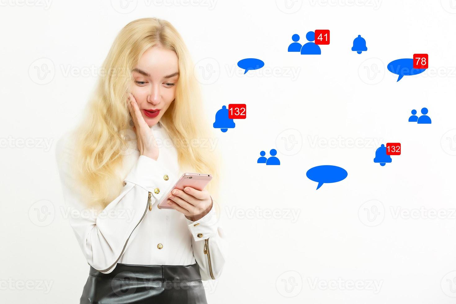 Amazed surprised girl looking at phone with open mouth, astonished young woman customer shocked by social media mobile online content holding cellphone isolated on white grey blank studio background photo