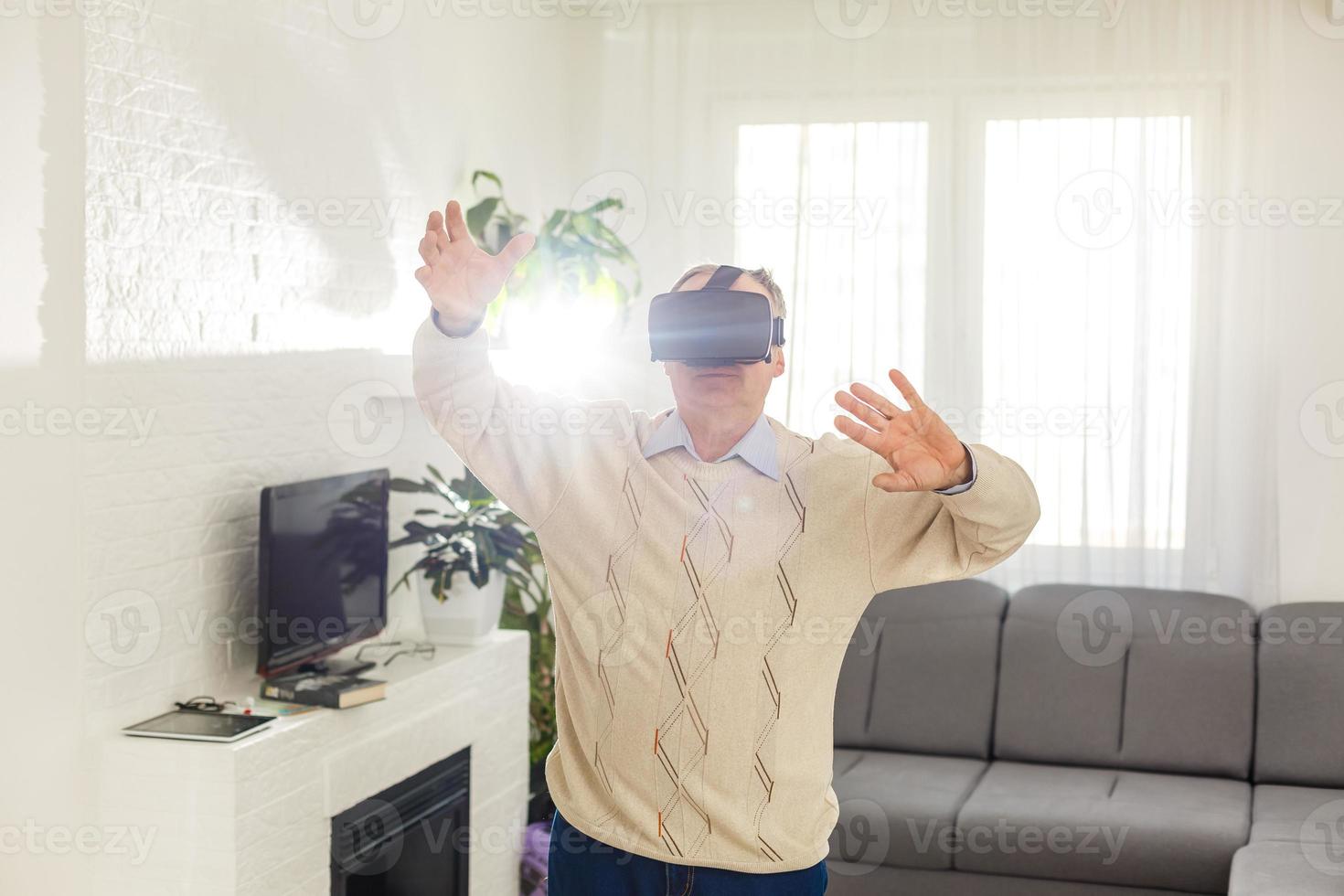 old man with virtual reality goggles photo