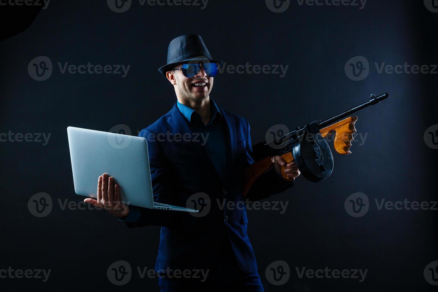 Film noir gangster shooting with gun photo