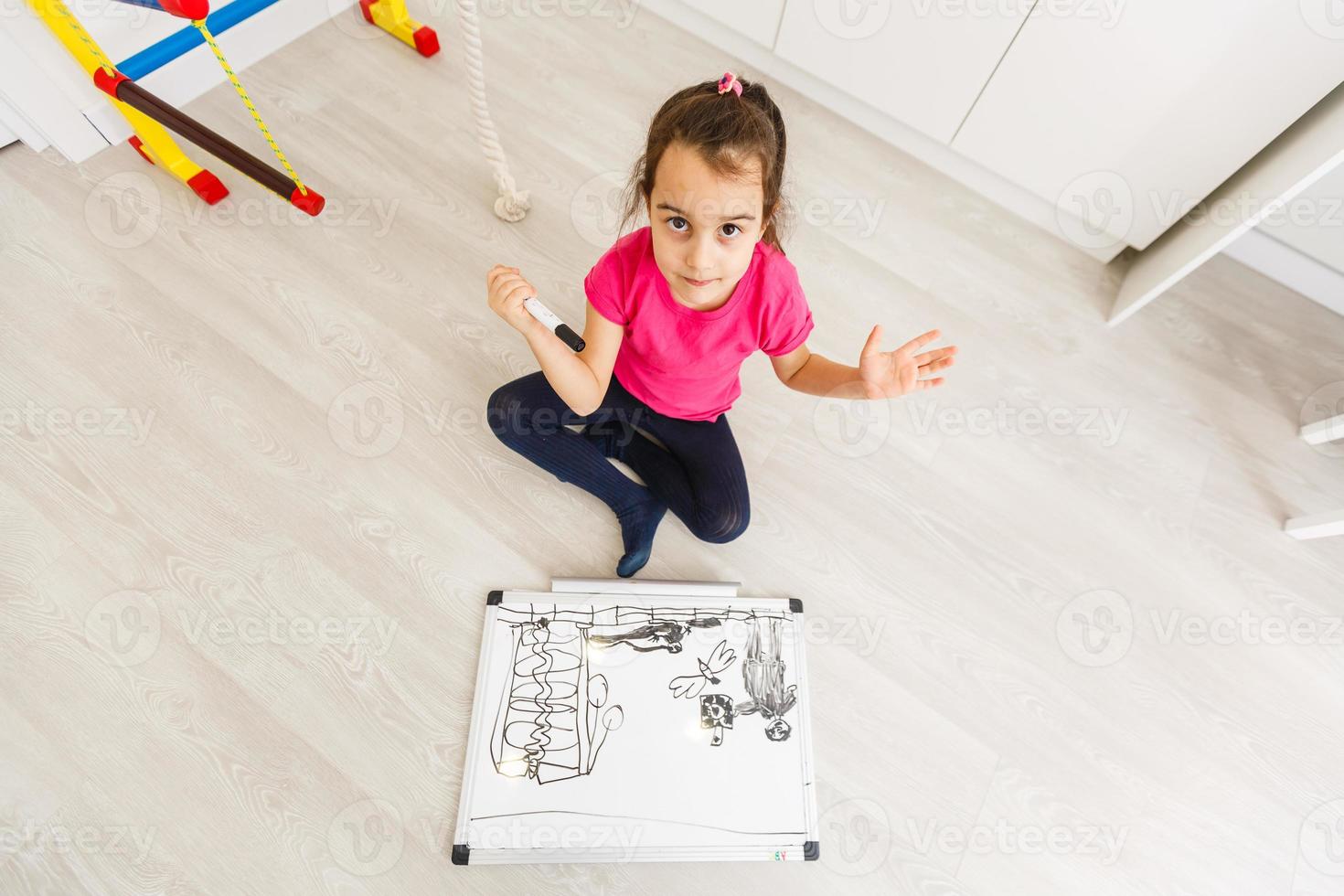 Little girl drawing - closeup shot photo