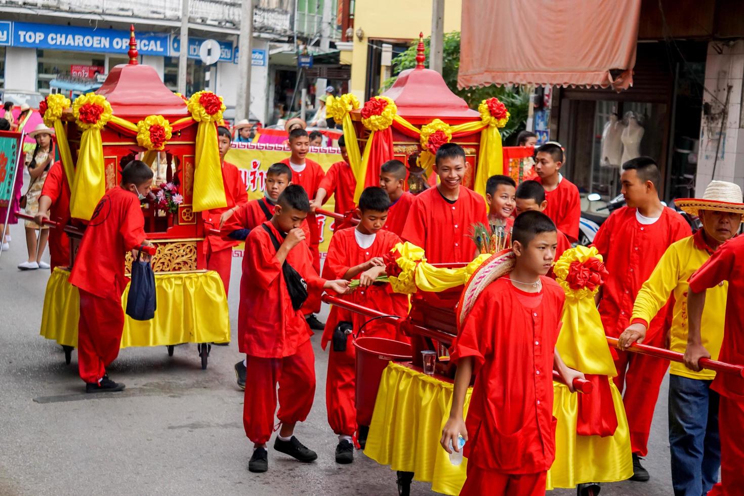 12 December 2018  Sedan chair of Chinese god with group of carrier in Chinese parade of respect the Chinese gods celebration of Lampang city. photo
