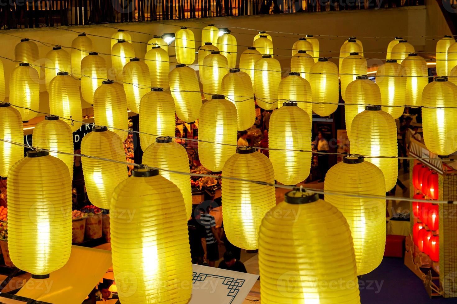 Closeup and crop group of Chinese lantern hang on in Chinese food market ceiling for welcome of Chinese lunar new year 2020. photo