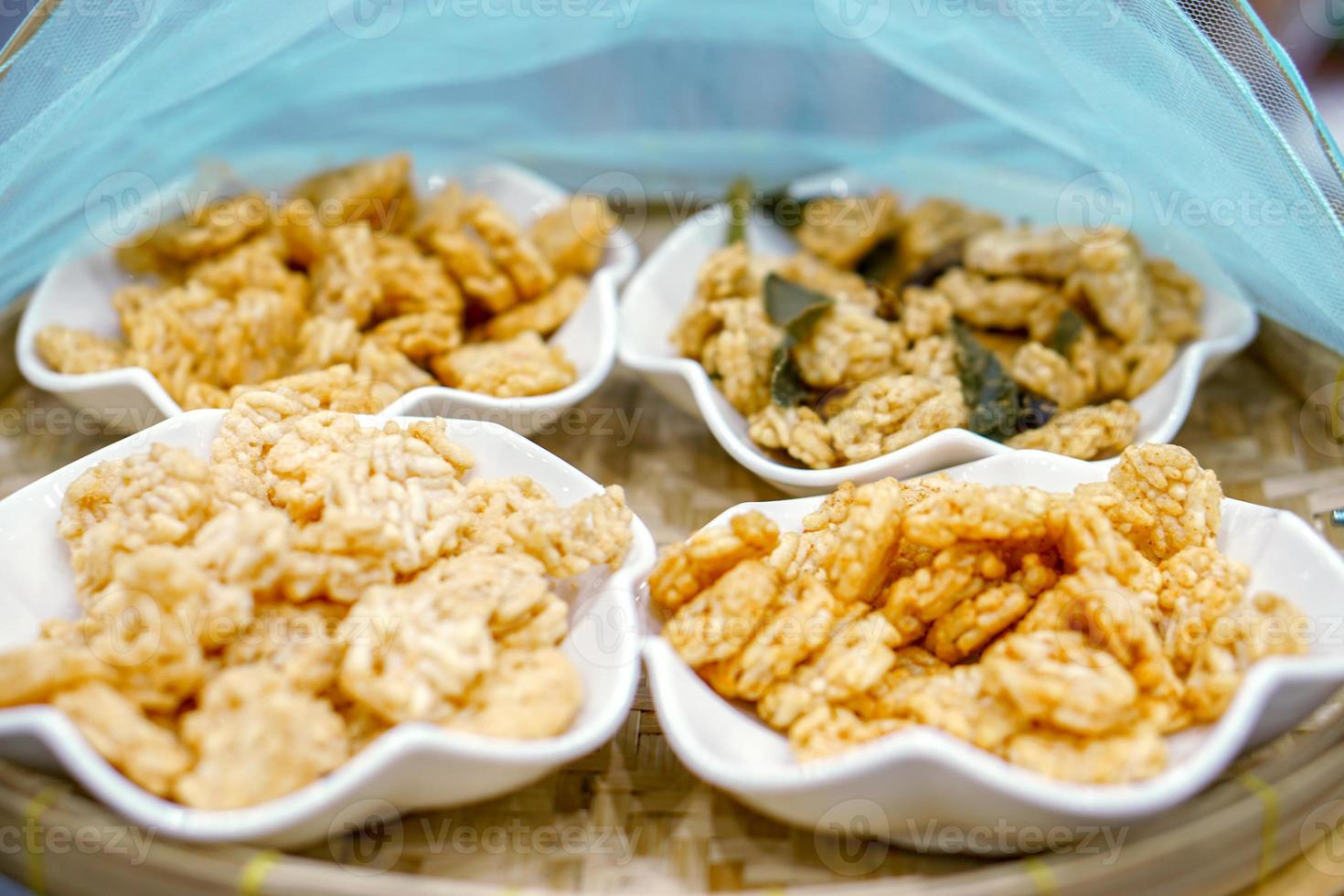 Thai northern rice cracker snack Khao tan Khao tan is an important dessert in a big merit ceremony made from fried sticky rice and sugar cane photo