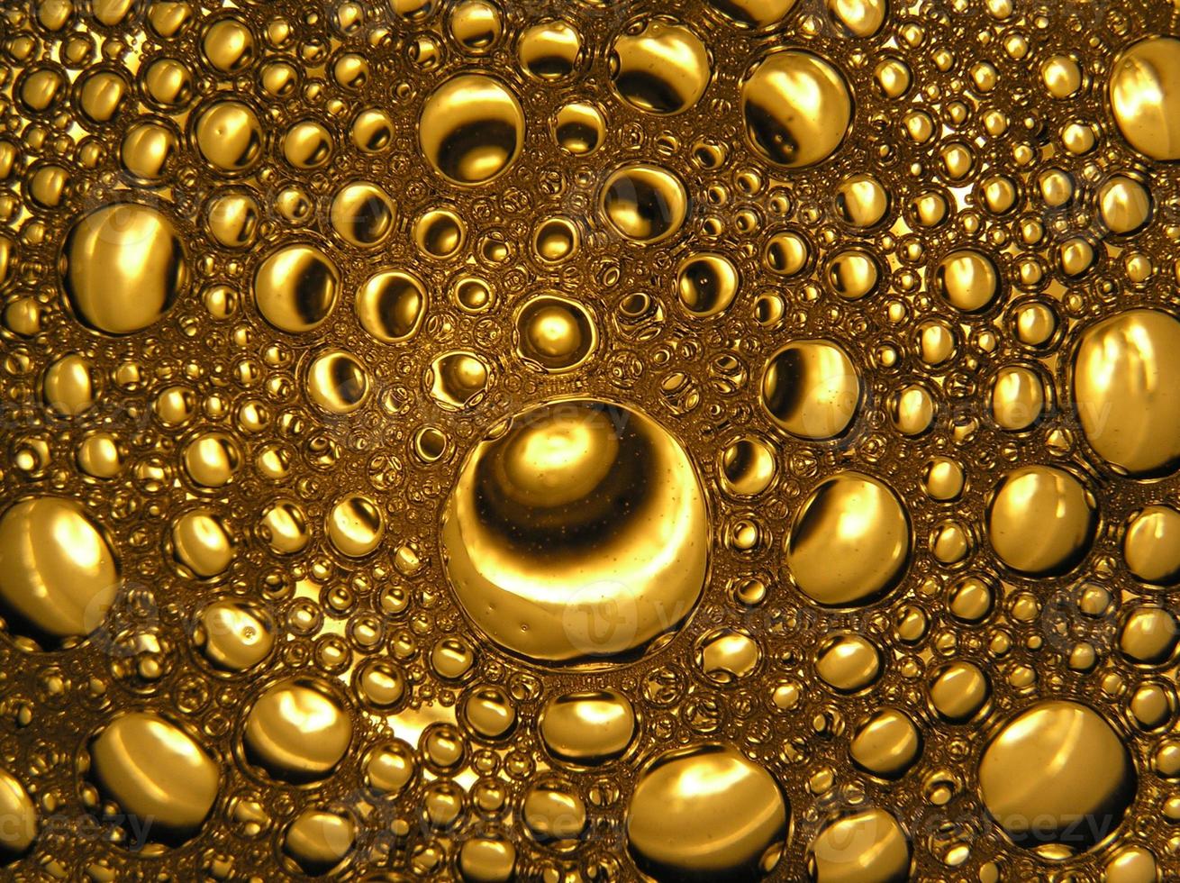 close up texture golden bubbles abstract, liquid metal photo