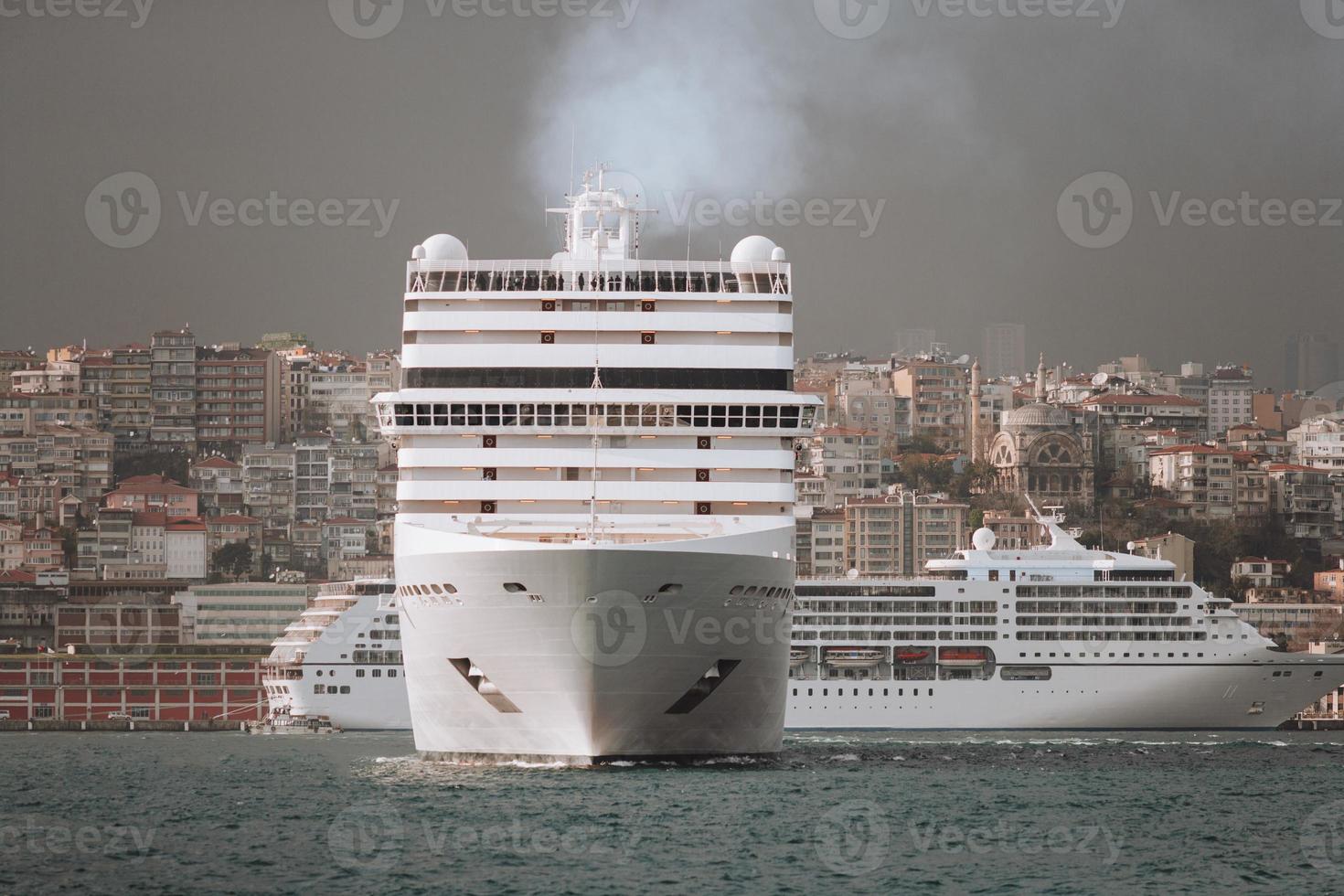 a large sea passenger liner departs from the shore for a trip. photo