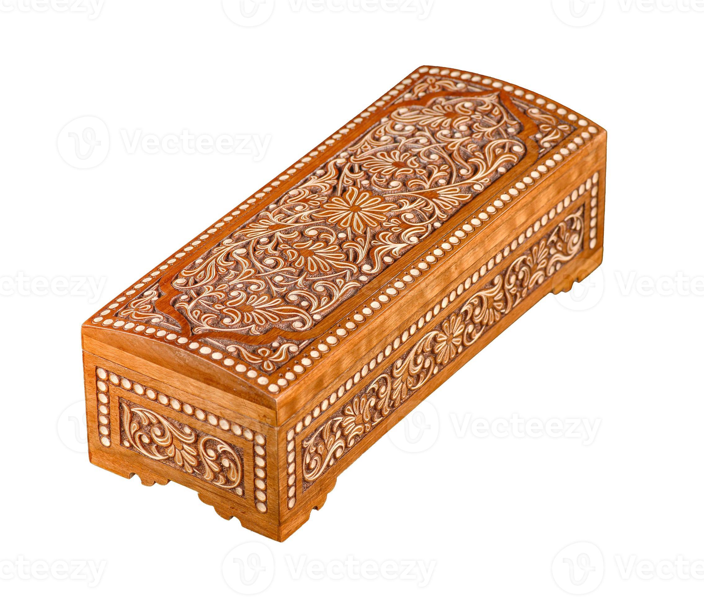 A wooden casket with traditional artistic carving isolated on a white