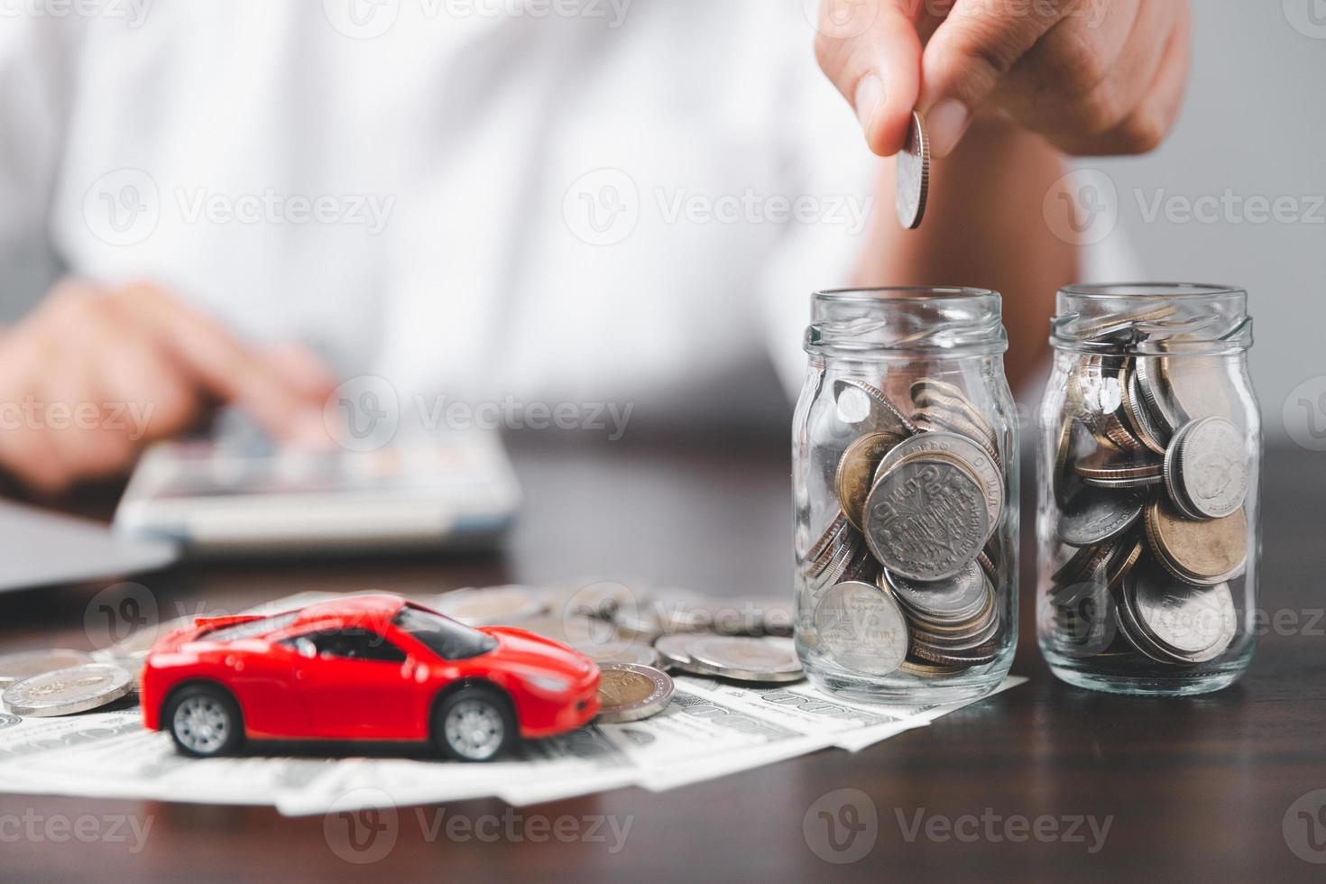 Concept of car insurance business, saving buy - sale with tax and loan for new car. Car toy vehicle with stack coin money on background. Planning to manage transportation finance costs. loan for car photo