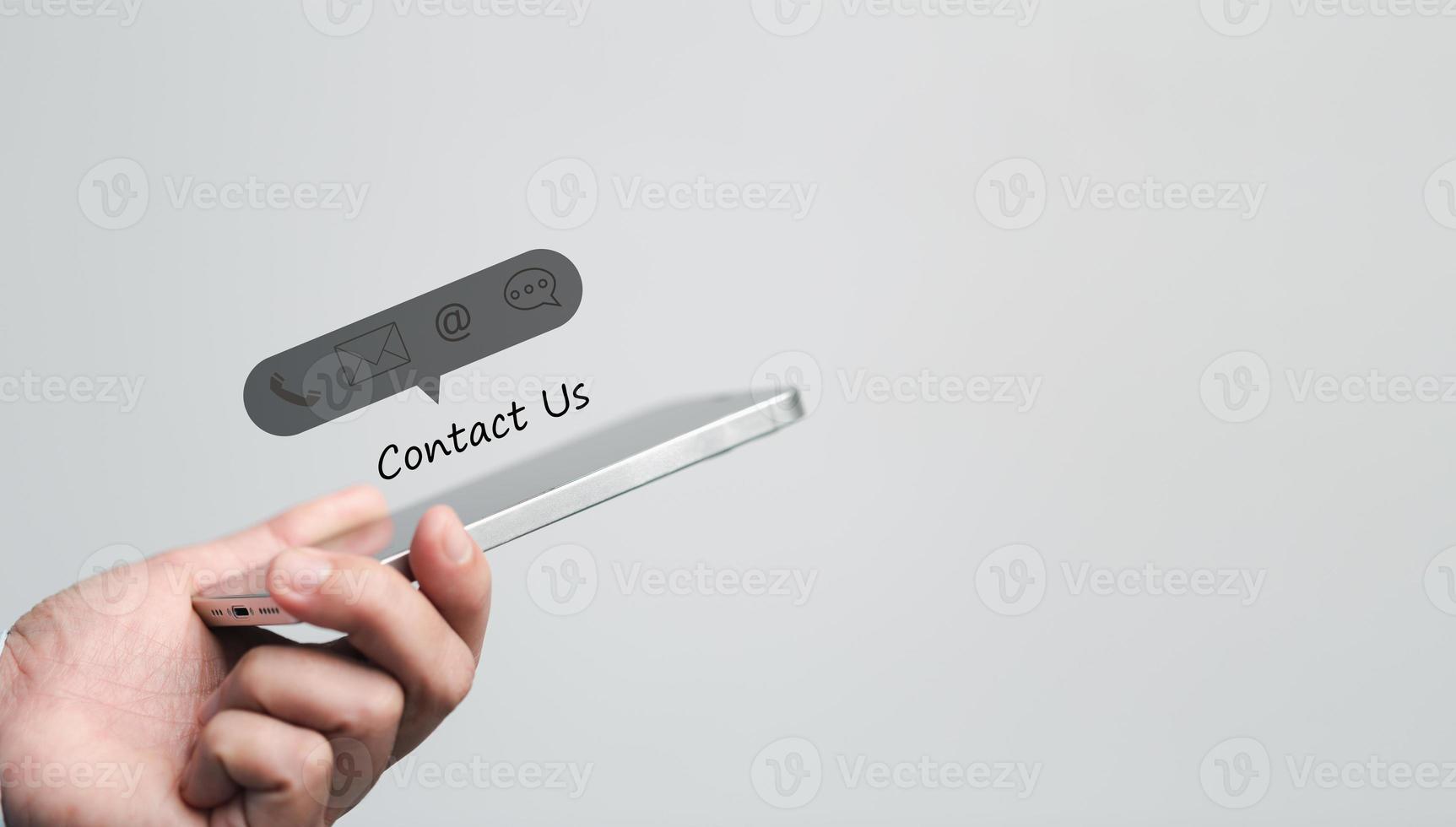 Businesswoman using phone and touching on virtual screen contact icons such as email, address, live chat, internet wifi. Contact us or Customer support hotline people connect. Connect with cyberspace. photo