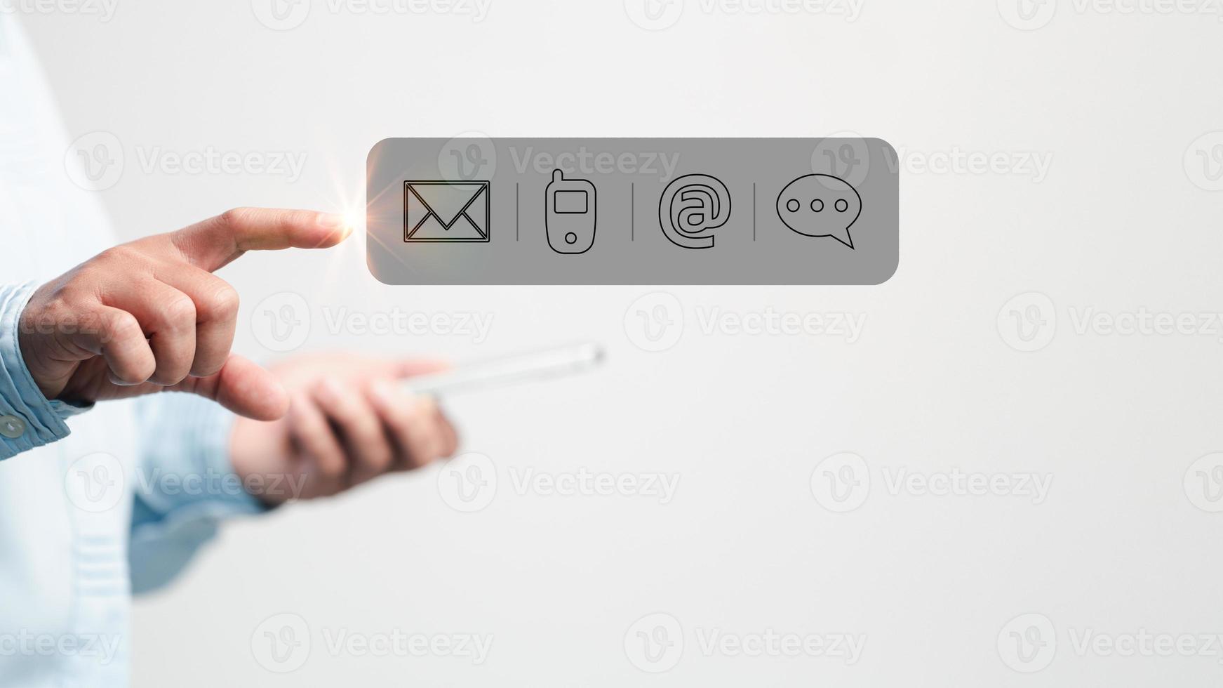 Businesswoman using phone and touching on virtual screen contact icons such as email, address, live chat, internet wifi. Contact us or Customer support hotline people connect. Connect with cyberspace. photo