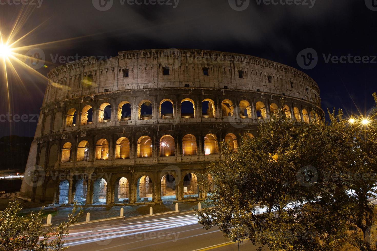 rome, italy, colosseum old ancient building gladiator battle at night. photo