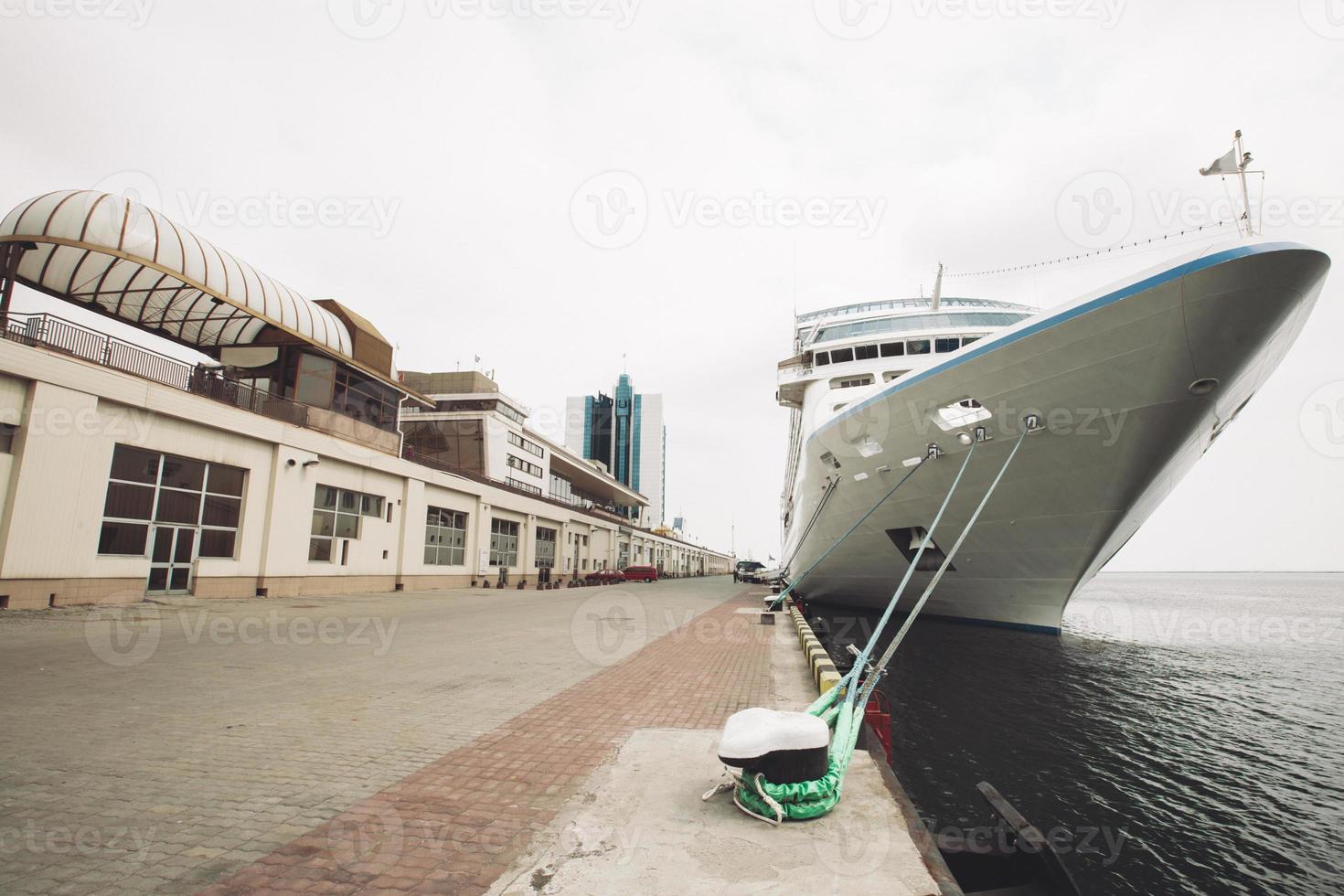 a large sea passenger liner is moored in the port. photo