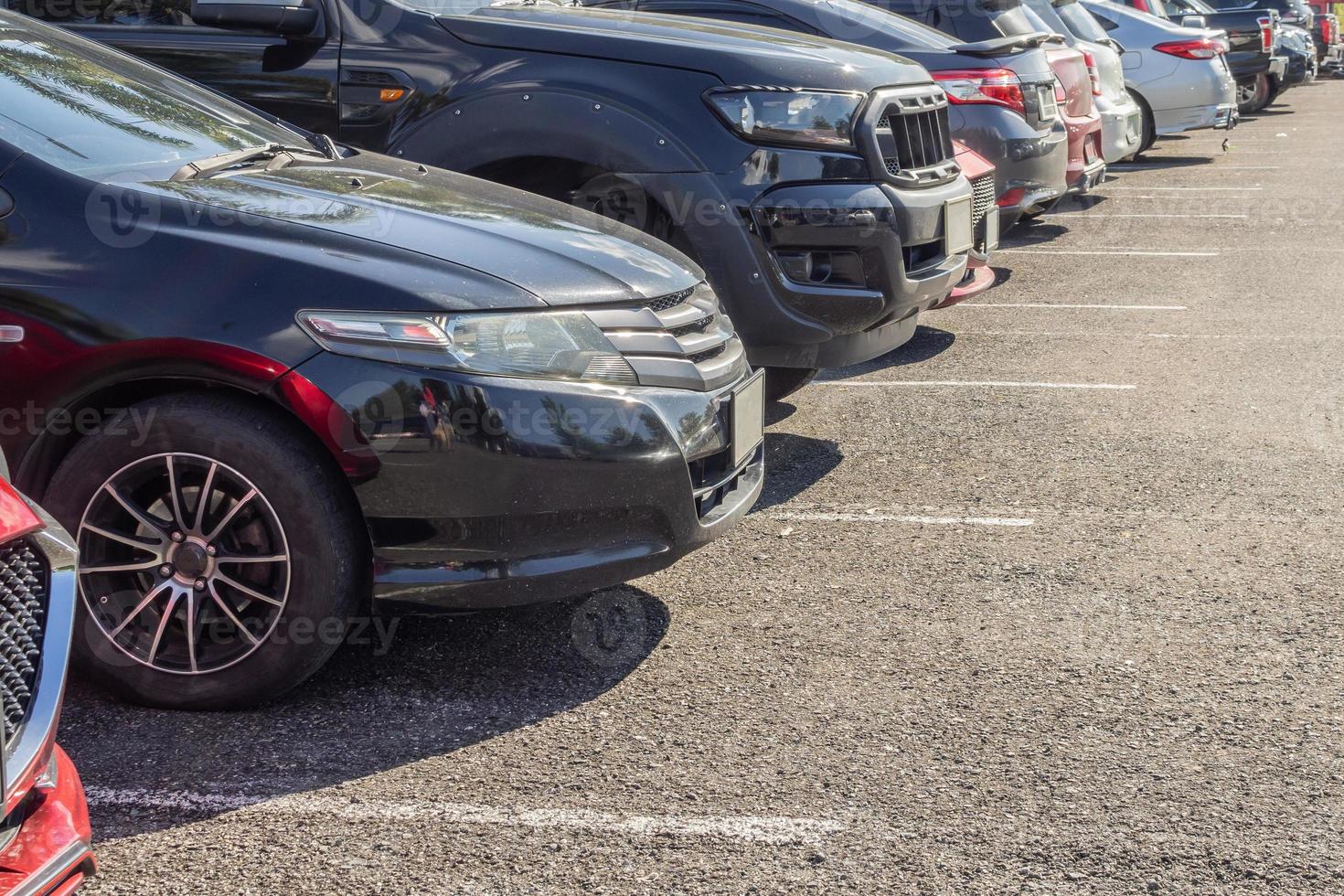 Cars parked in the outdoor parking lot photo