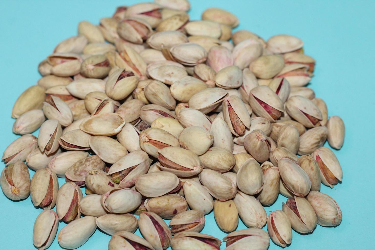 Different dried fruits and nuts on white background, top view. Space for text photo