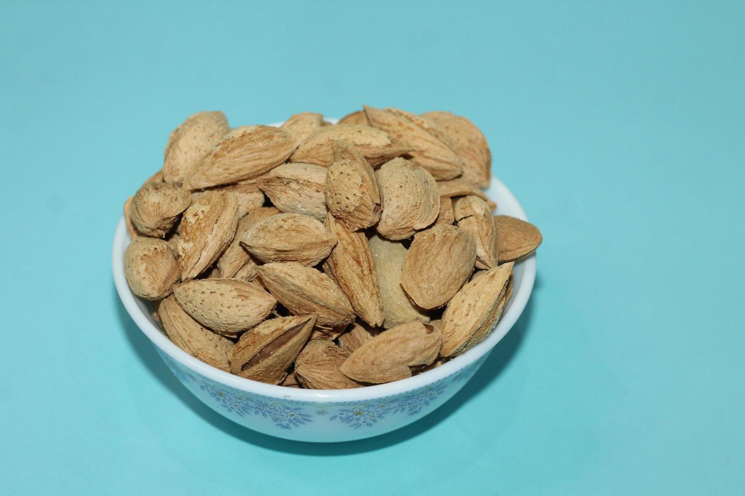 Different dried fruits and nuts on white background, top view. Space for text photo