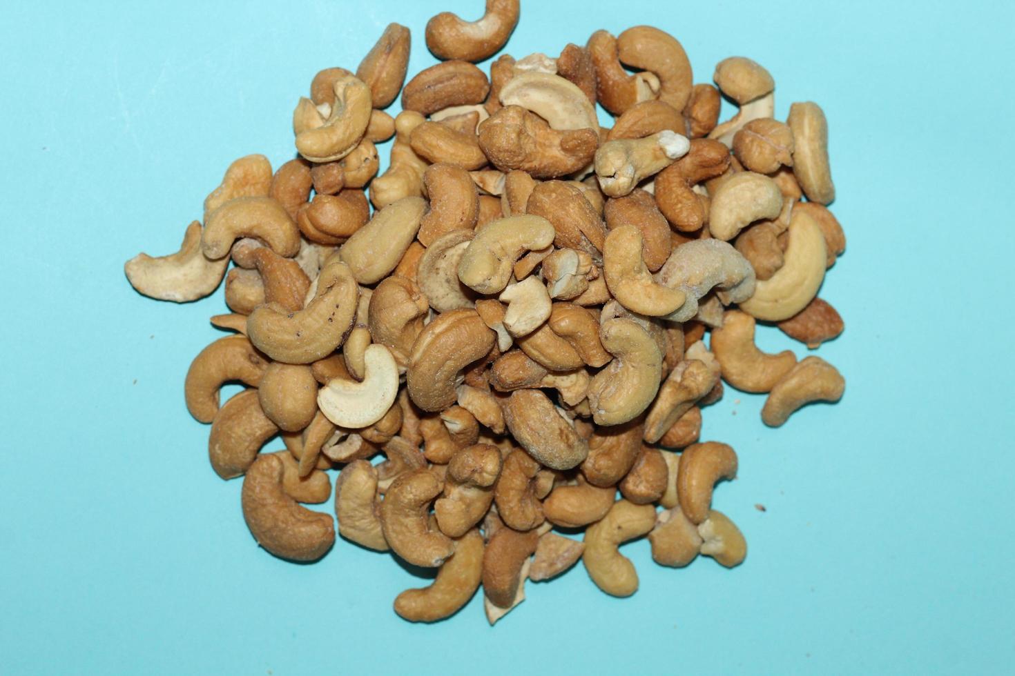 Different dried fruits and nuts on white background, top view. Space for text photo