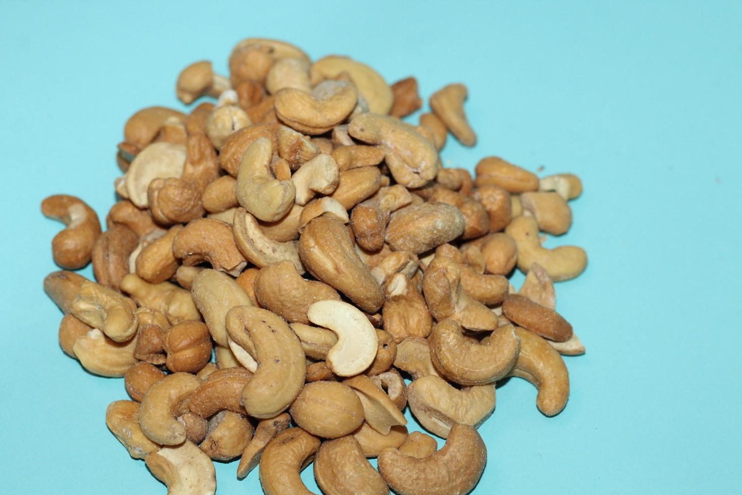 Different dried fruits and nuts on white background, top view. Space for text photo