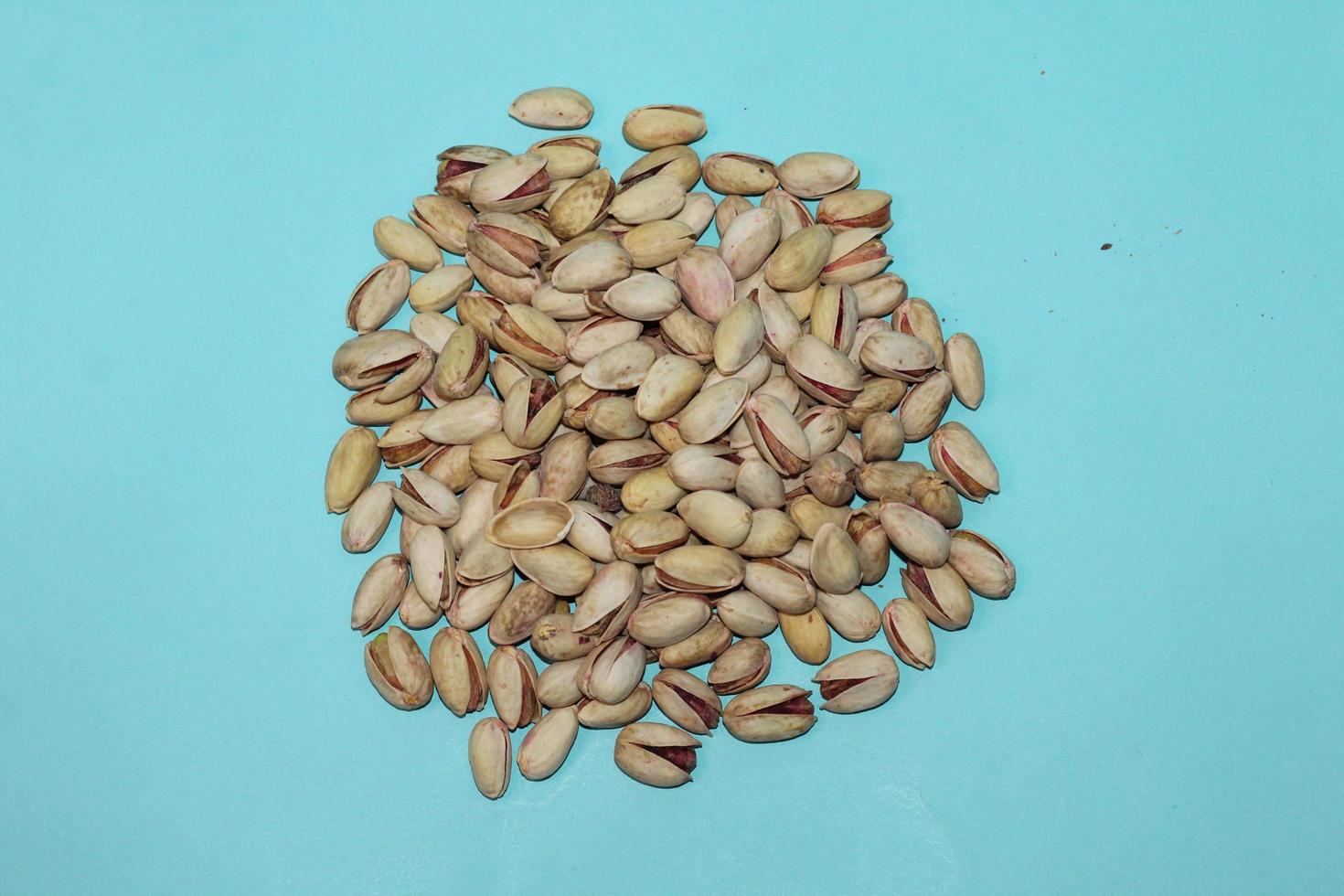 Different dried fruits and nuts on white background, top view. Space for text photo