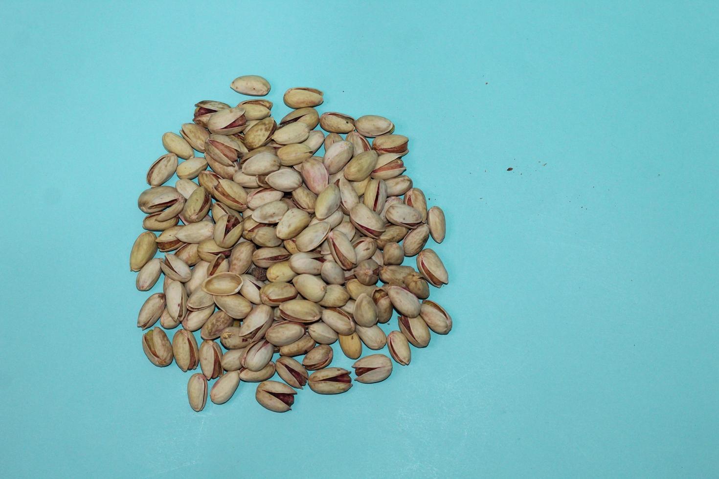 Different dried fruits and nuts on white background, top view. Space for text photo