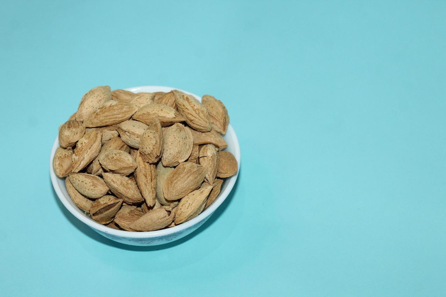 Different dried fruits and nuts on white background, top view. Space for text photo