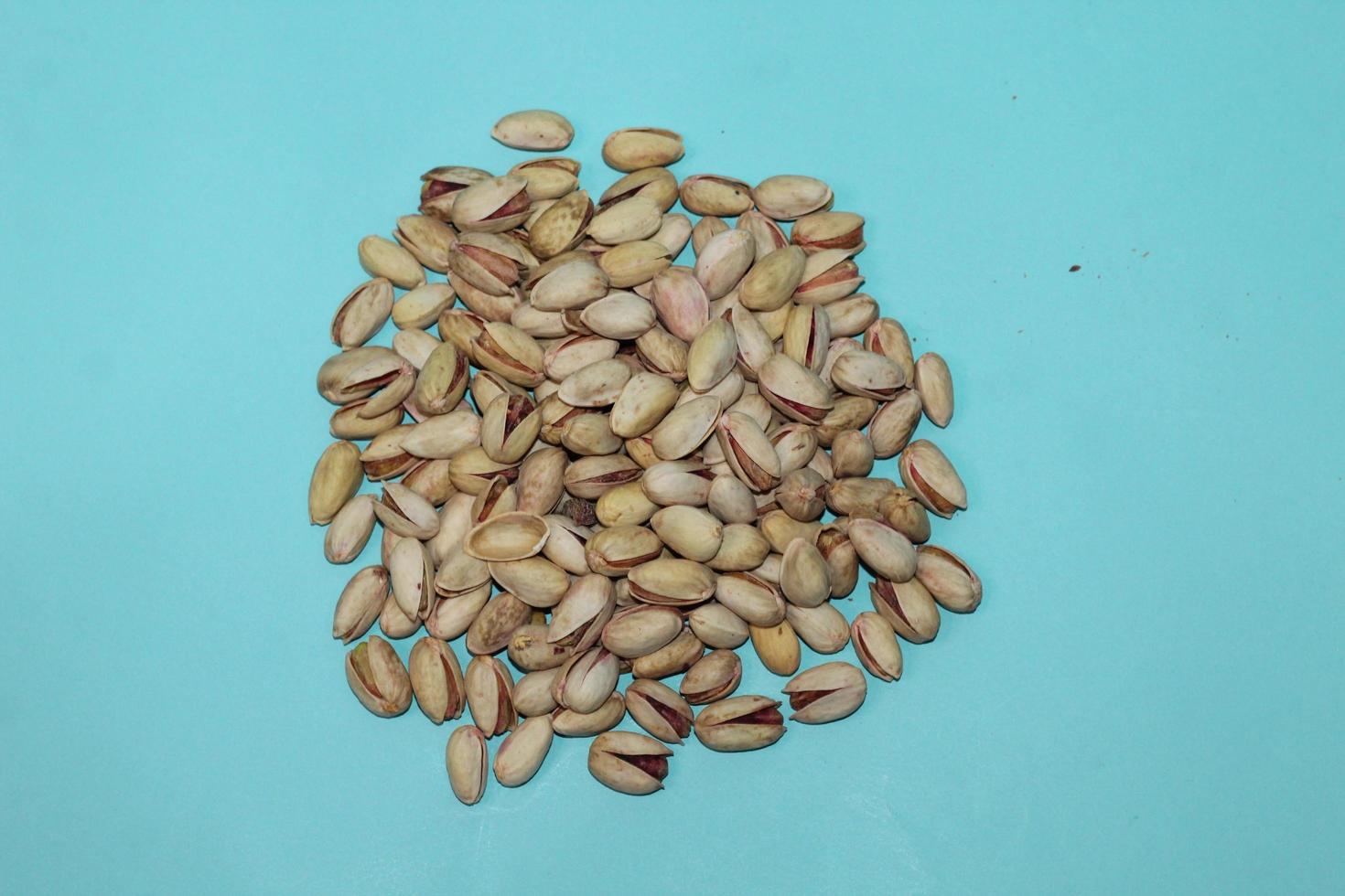 Different dried fruits and nuts on white background, top view. Space for text photo