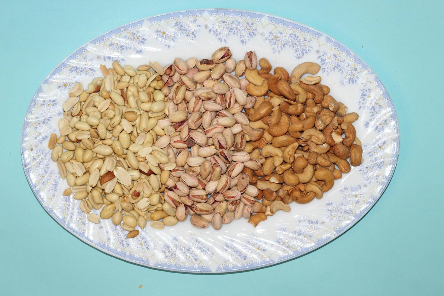 Different dried fruits and nuts on white background, top view. Space for text photo