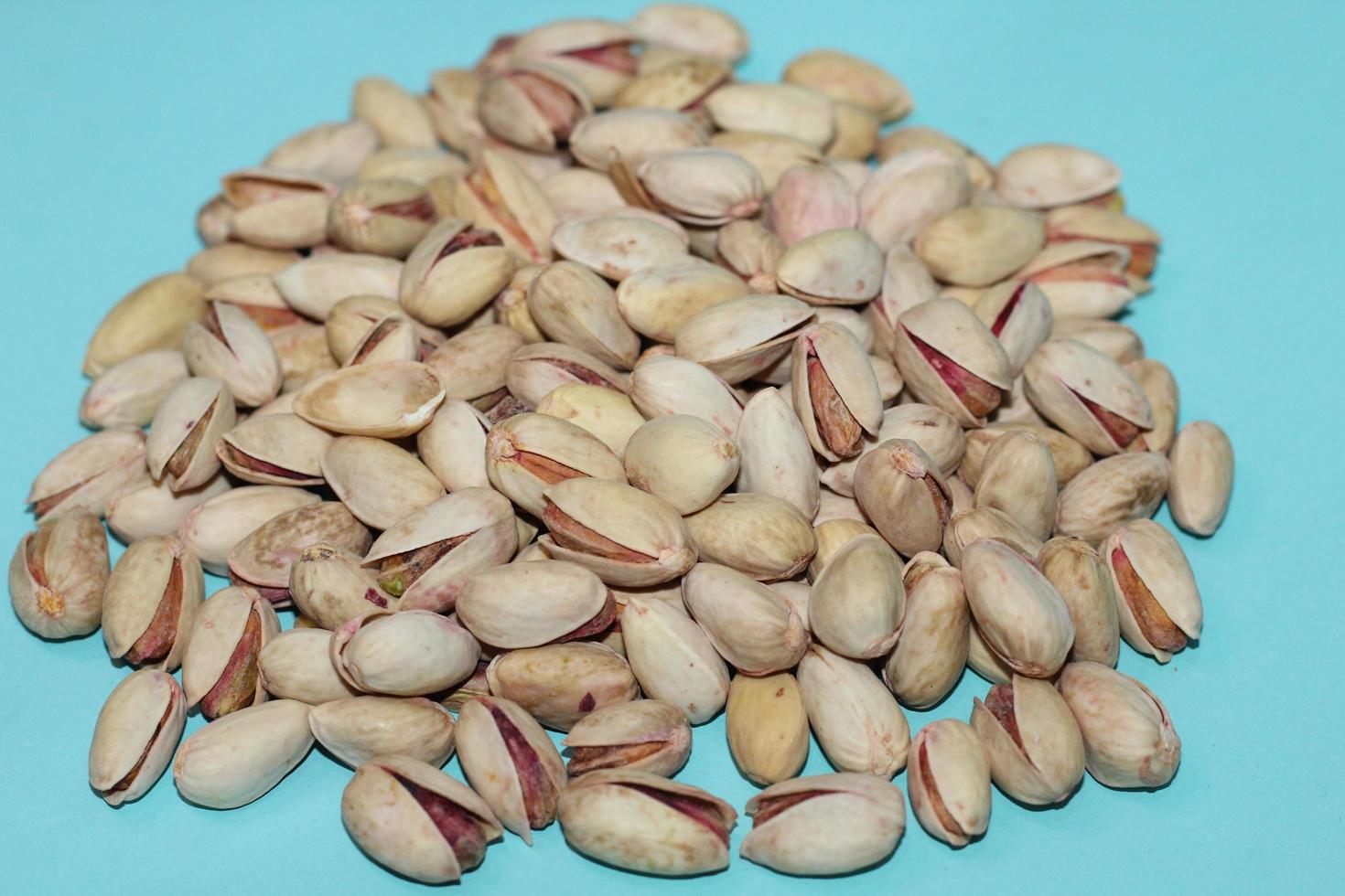 Different dried fruits and nuts on white background, top view. Space for text photo