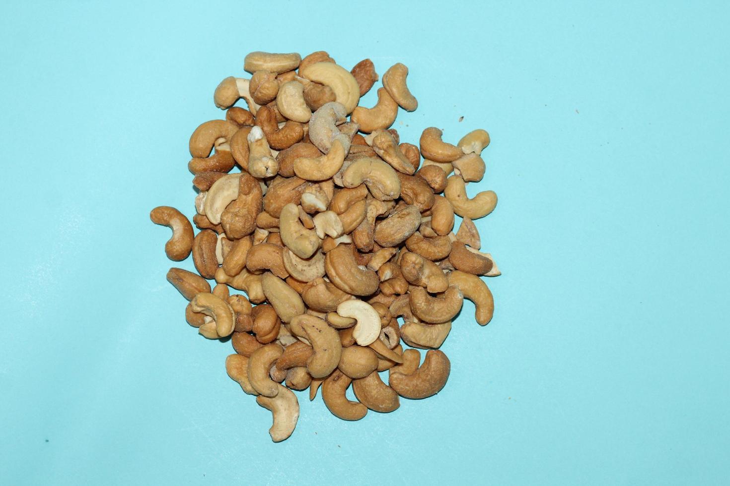 Different dried fruits and nuts on white background, top view. Space for text photo