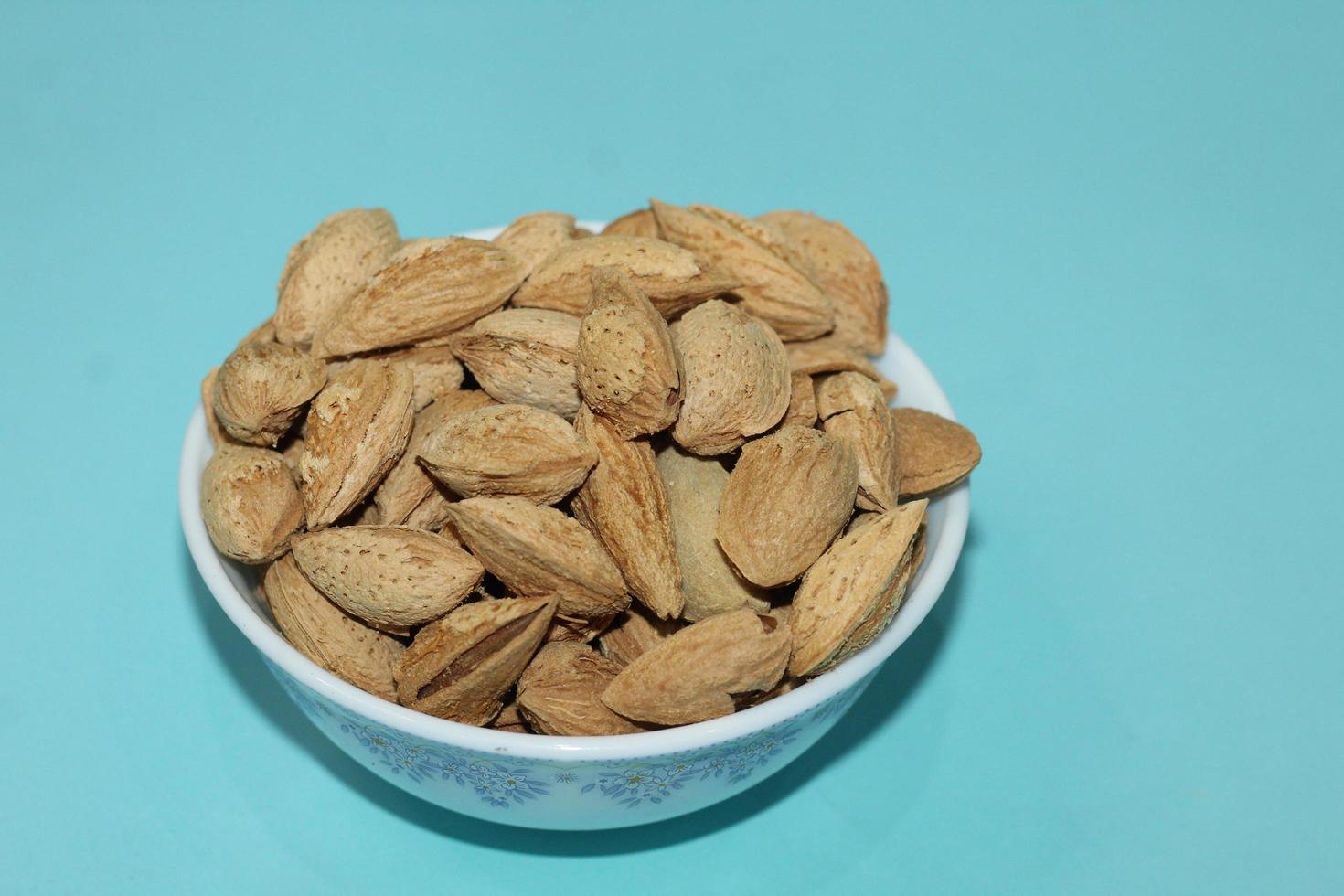 Different dried fruits and nuts on white background, top view. Space for text photo