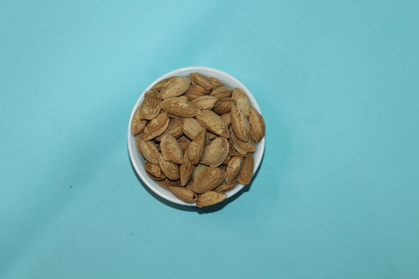 Different dried fruits and nuts on white background, top view. Space for text photo