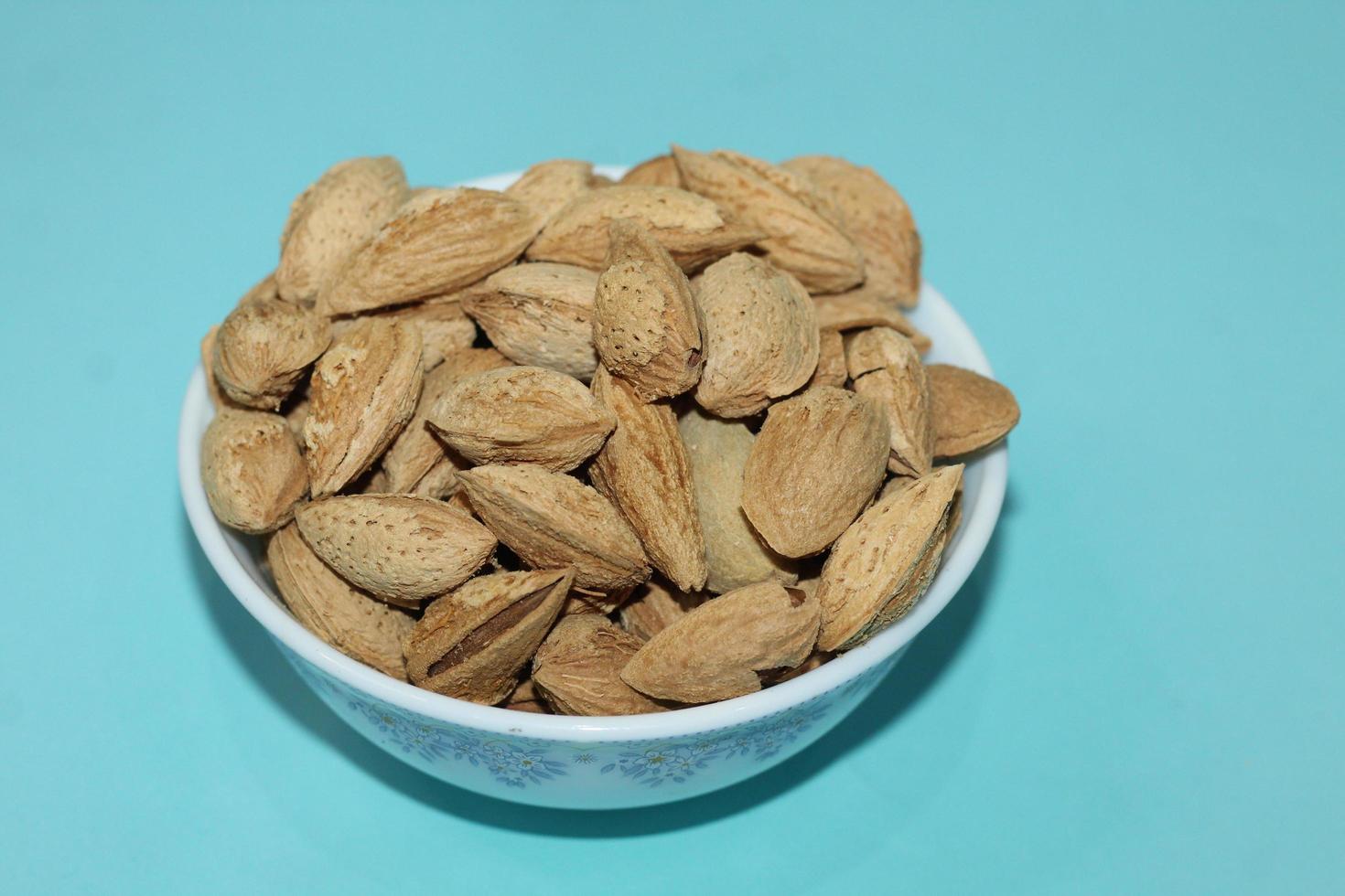 Different dried fruits and nuts on white background, top view. Space for text photo