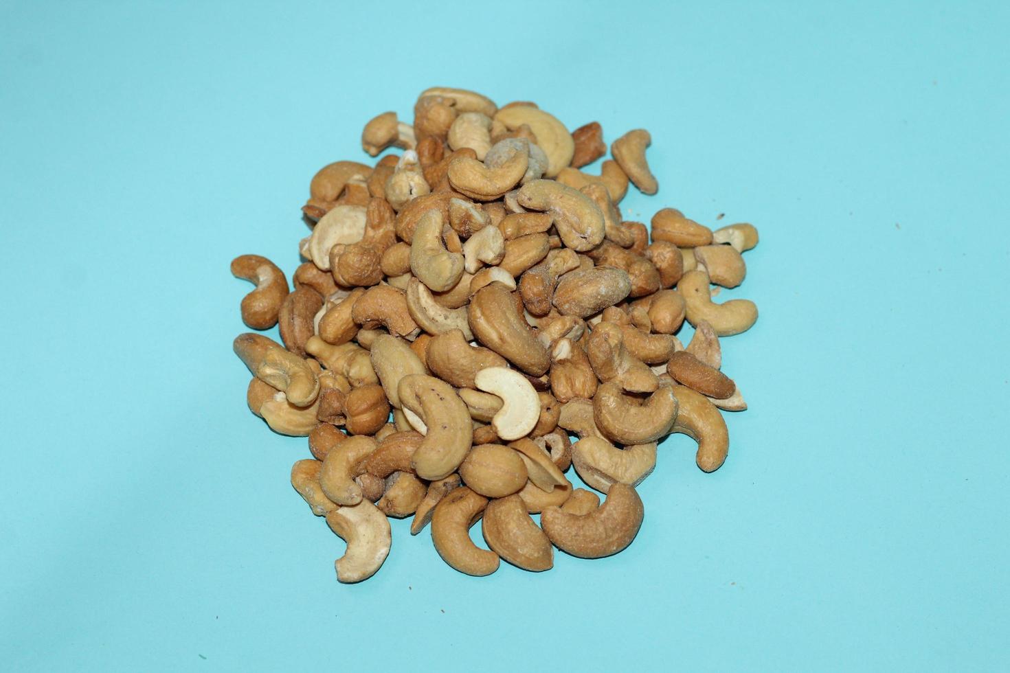 Different dried fruits and nuts on white background, top view. Space for text photo