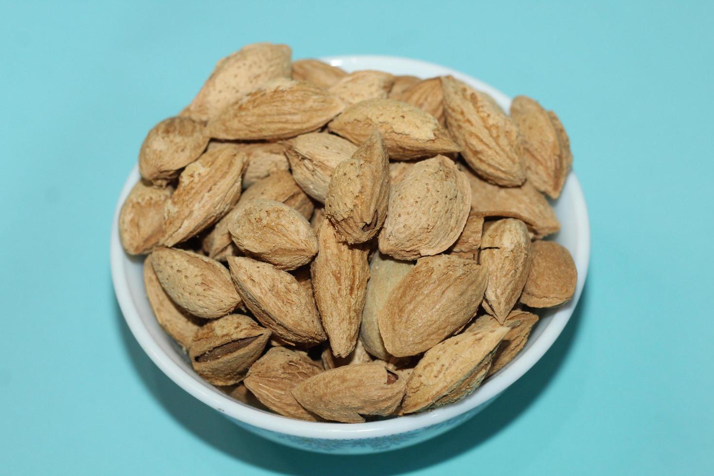 Different dried fruits and nuts on white background, top view. Space for text photo