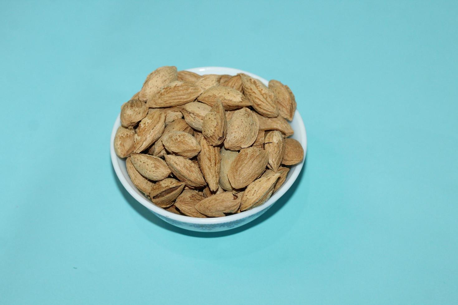 Different dried fruits and nuts on white background, top view. Space for text photo