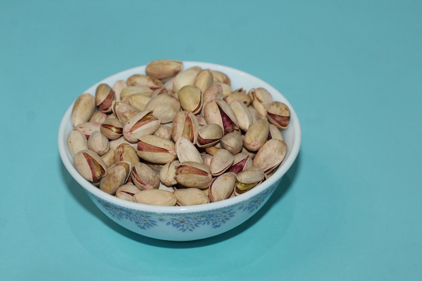 Different dried fruits and nuts on white background, top view. Space for text photo
