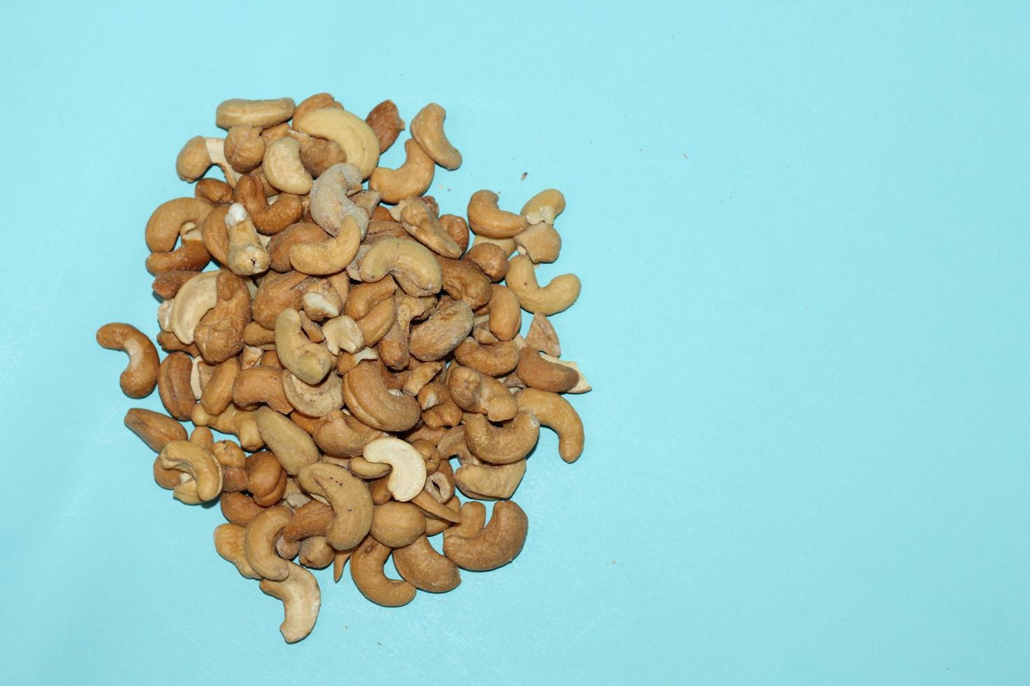 Different dried fruits and nuts on white background, top view. Space for text photo