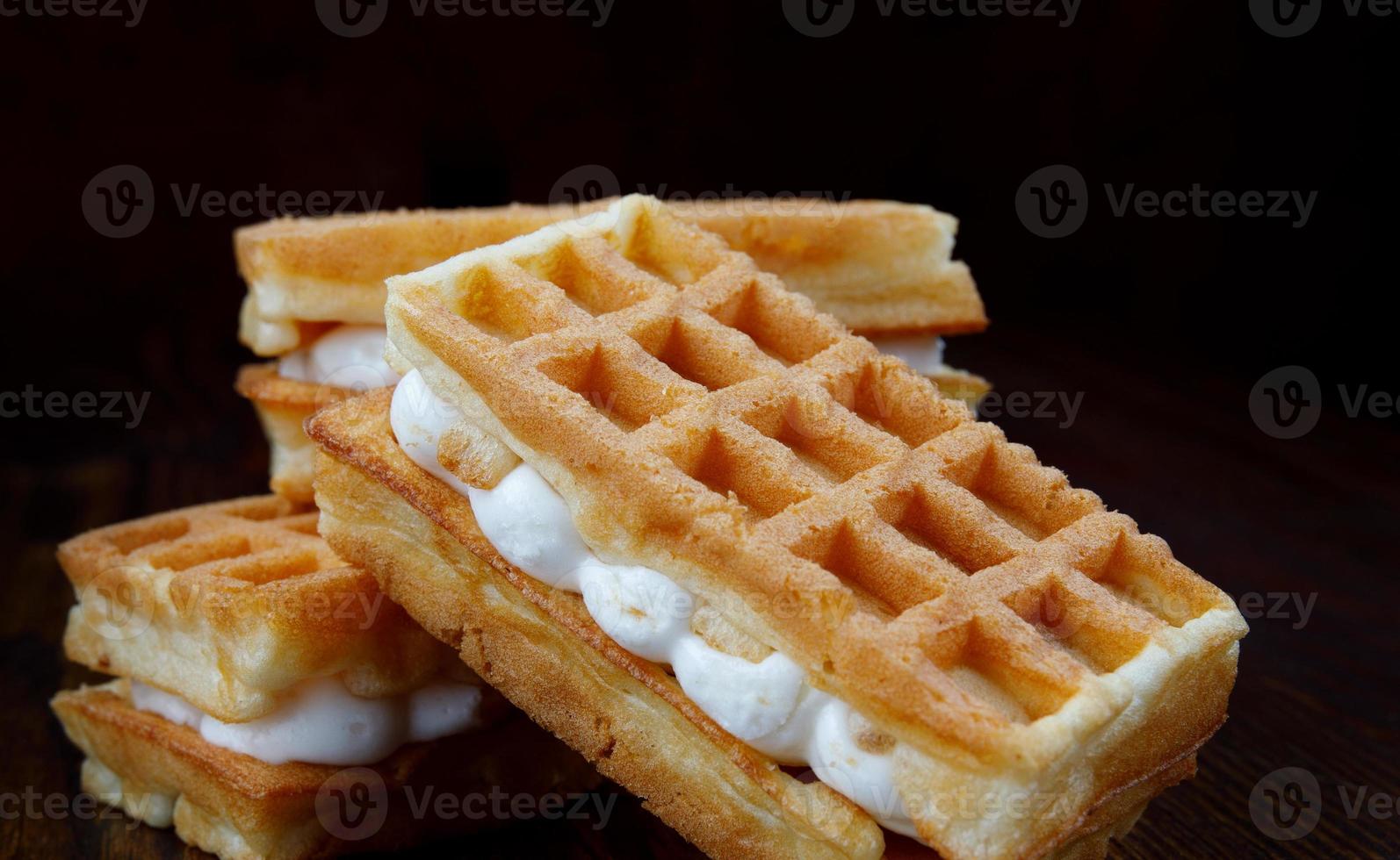 Square fresh Viennese waffles with cream. photo