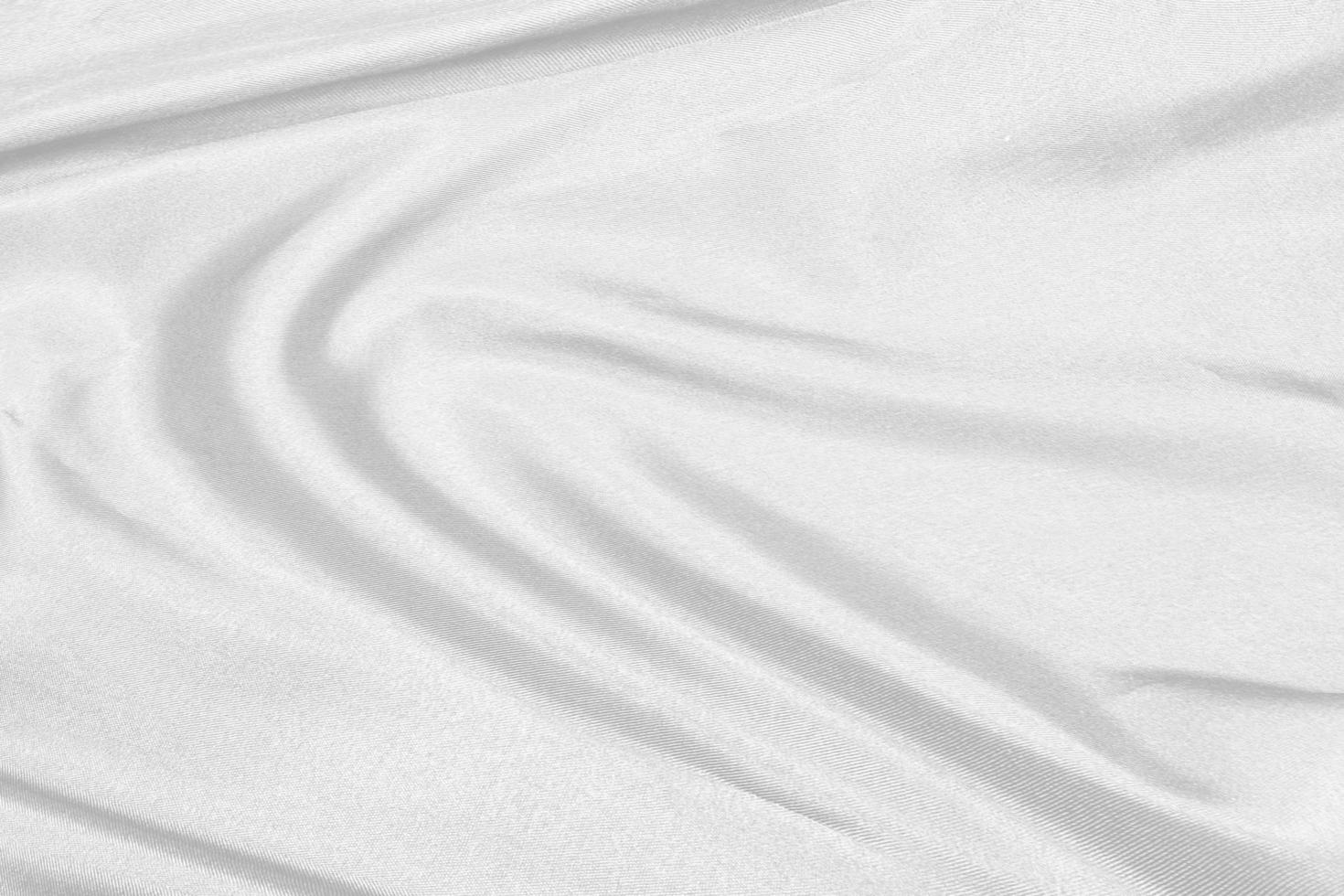 Smooth elegant white silk fabric or satin luxury cloth texture for drapery luxurious abstract design background photo
