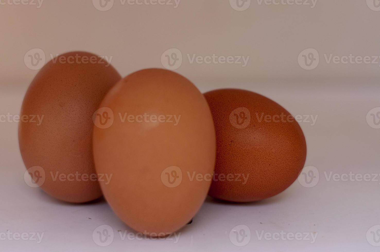 The group of raw eggs isolated on white background photo