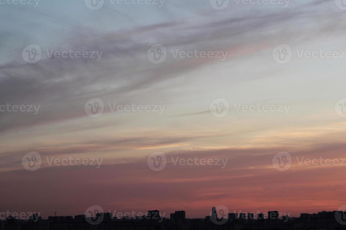 Colorful cloudy twilight beautiful sky cityscape sunset and morning sunrise. Dramatic evening night early morning view with city buildings silhouette. Panoramic background concept. Copy space for text photo
