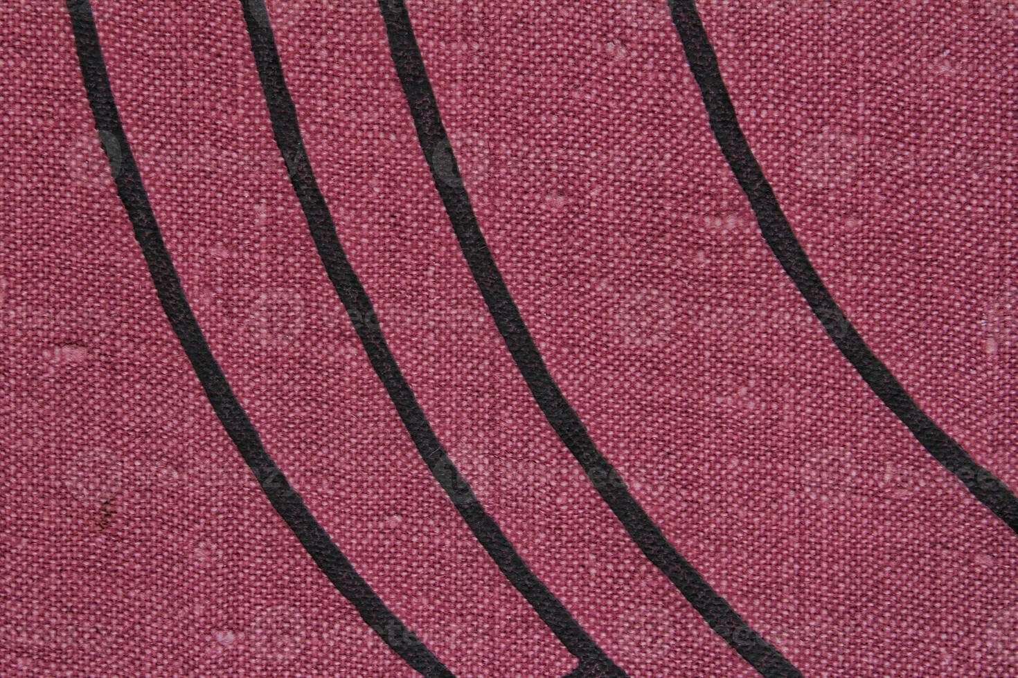 Abstract design background of violet coarse-grained intersection texture of rough fabric with an interlacing black painted lines. Linen sack textile canvas burlap cloth. Close-up, mock up, top view photo