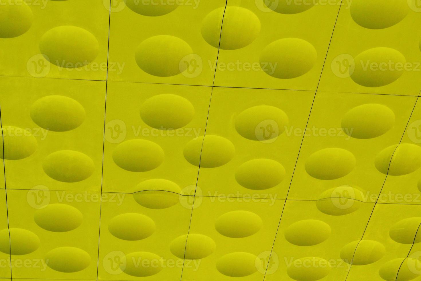 The close-up of yellow detailed sphere texture reverse side of the plastic tile. Rough embossed lattice. Concept of design. Wall decoration interior. Relief balls geometric pattern. Flatlay, mock up photo