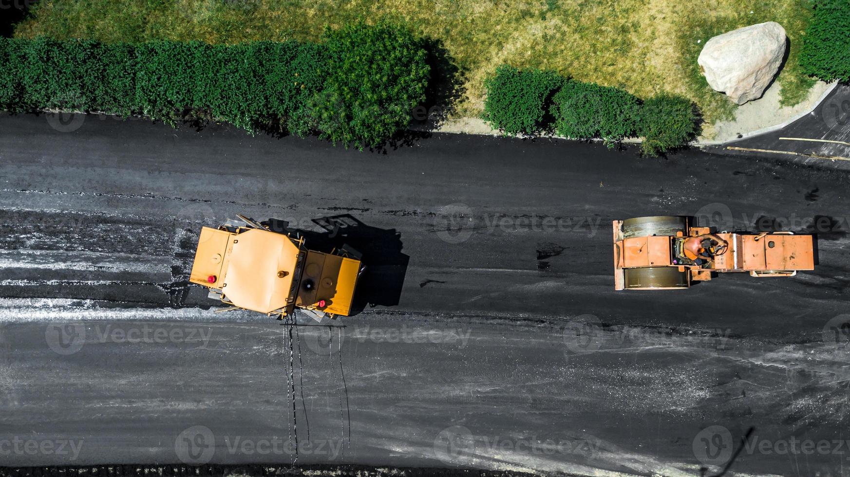 Aerial view on the new asphalt road under construction photo