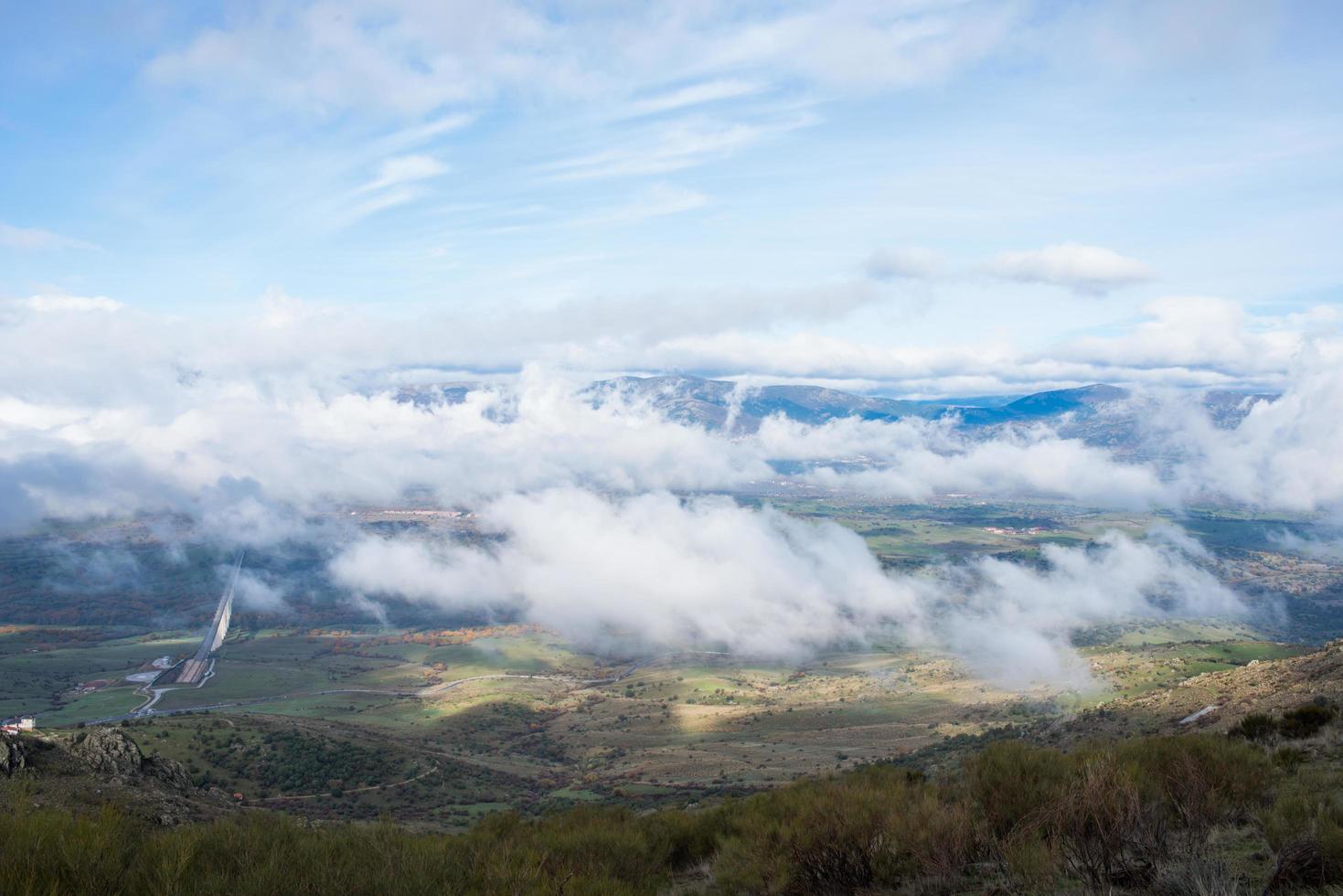 Beautiful aerial view.  Low clouds over the valley photo