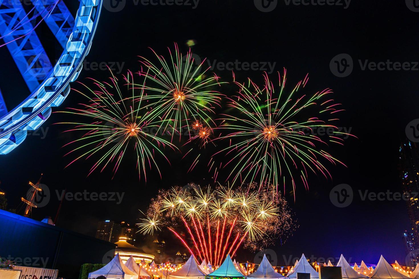 fireworks on the river in the dark sky photo