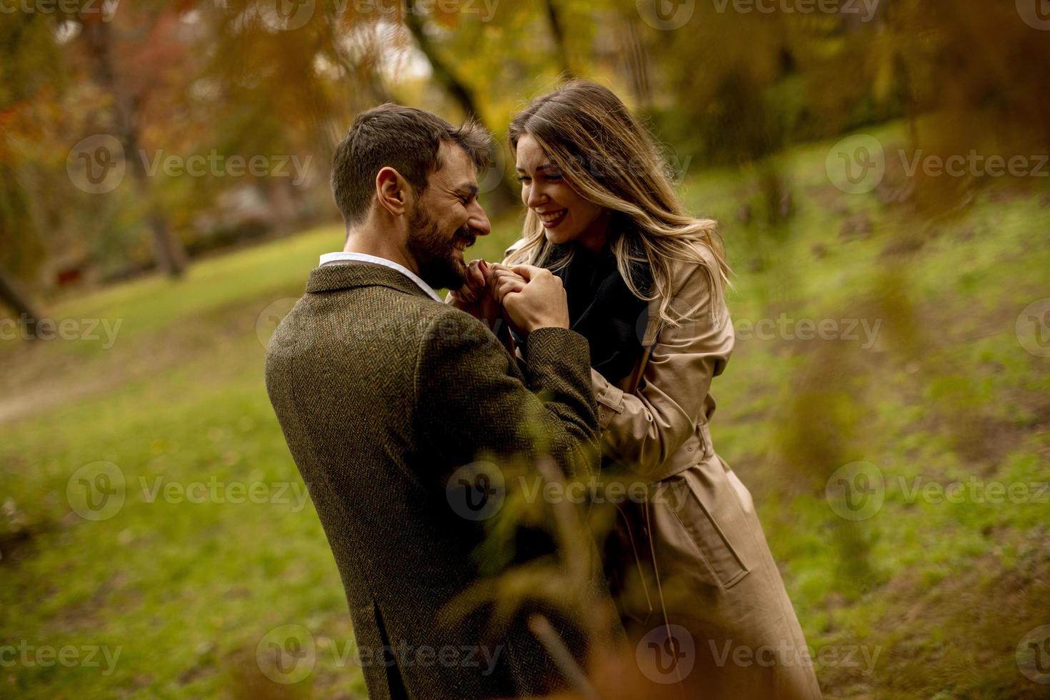 Young couple in the autumn park photo