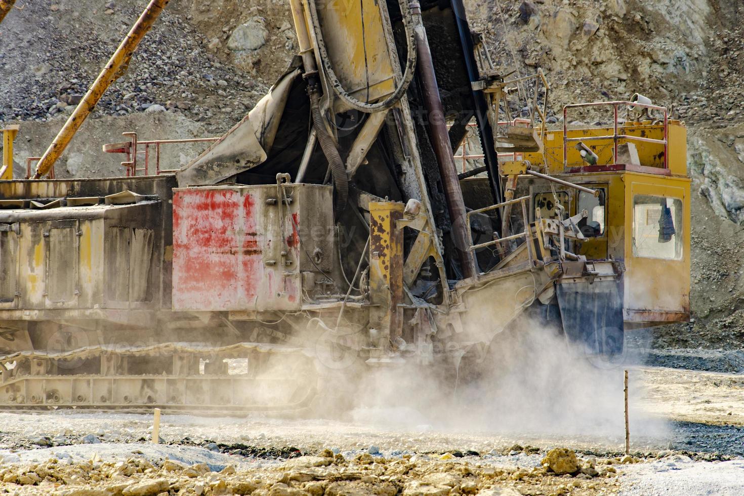 Drilling rig in open pit mine photo